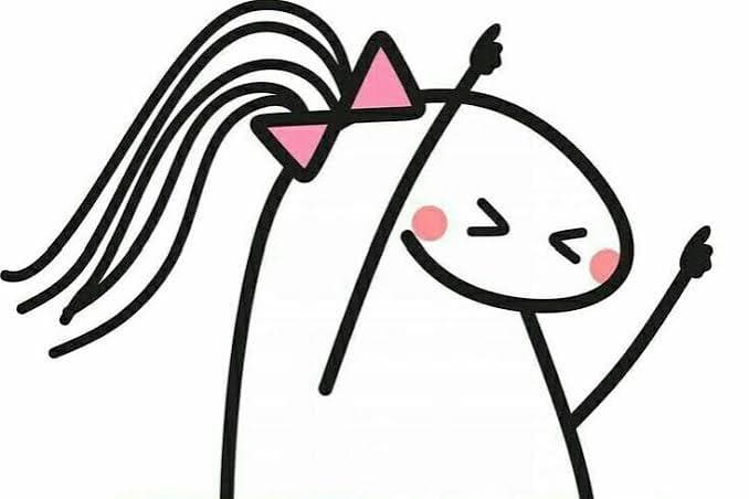 Niña dancing with a pink bow and a big smile